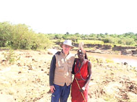 Hugh with his Masai guide Photo from Susan's Story, he with his Masai guide