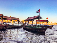 an abra crossing to the old city of Dubai an abra crossing to the old city of Dubai