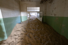 the sand is coming into the hospital here at Kolmanskuppe Ghost Town Susan's Story, the sand is coming into the hospital here at Kolmanskuppe Ghost Town