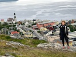 Susan at the top of the mountain above Hammerfest on a cloudy cold July morning looking for reindeer Photo from Susan's Story, Europe 2018, Susan at the top of the mountain above Hammerfest on a cloudy cold July morning looking for reindeer