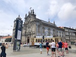 A trolley goes in front of a cathedral in Porto, Portugal Photo from Susan's Story, Europe 2018, A trolley goes in front of a cathedral in Porto, Portugal