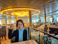 Susan raising a toast in the main dining room of Oceania Marina Photo from Susan's Story, Susan raising a toast in the main dining room of Oceania Marina