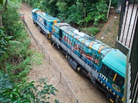 Susan's Story, The engines of the Kuranda Railroad were painted in Aborigional dream time creation schemes