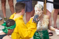 Susan's Story, The social hostess of the Insignia had not crossed the equator and thus had to kiss the fish and go through the initiation to transform from a polywog to a shellback. Here she is during her humiliation.